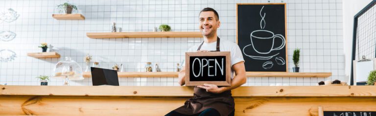Small business owner opening shop
