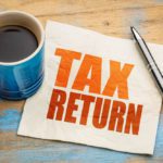 Tax return word abstract on napkin