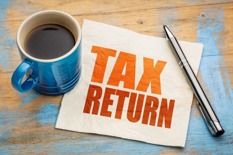 Tax return word abstract on napkin